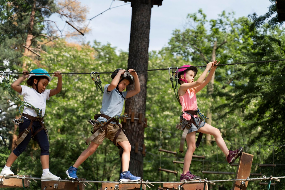 Kids engaged in outdoor physical activities at adventure camp