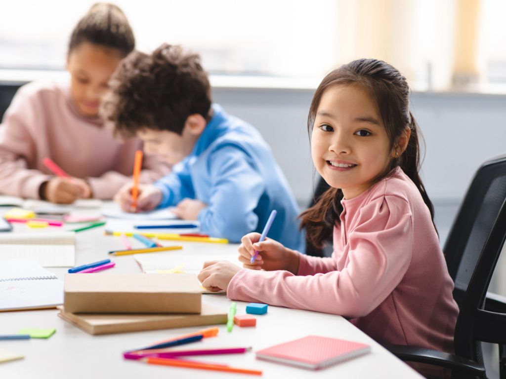 Young girl participating in nursery class activities.