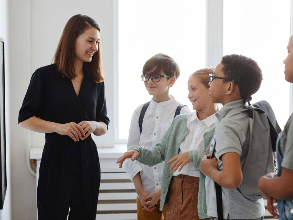 A teacher is having a conversation with the kids about teaching them ways to handle disagreements respectfully.